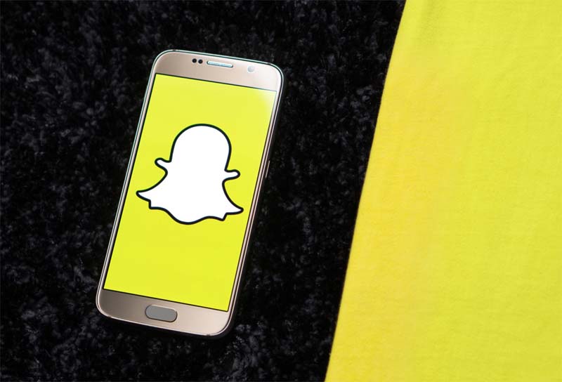 Cell phone displaying Snapchat logo