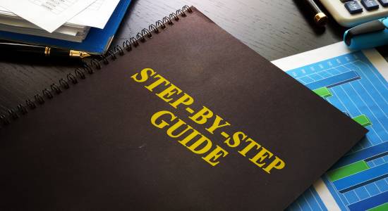 step-by-step guide book on desk