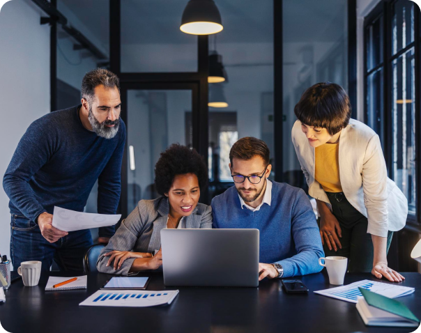 A group of employees gathered overtime to discuss a project