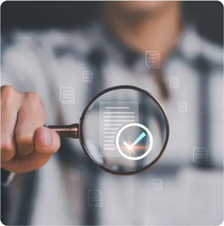 A man examines a checklist closely with a magnifying glass, highlighting attention to detail and thoroughness in his work.