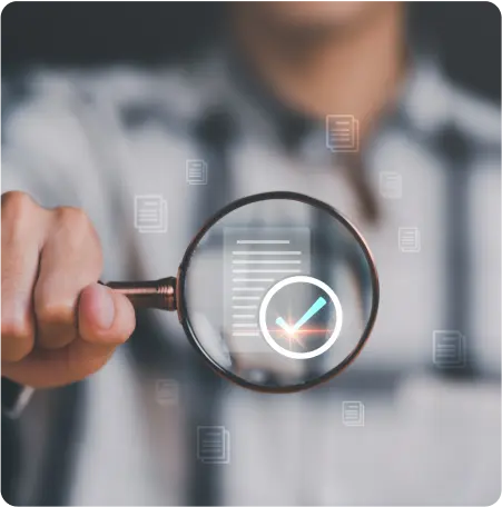 A man examines a checklist closely with a magnifying glass, highlighting attention to detail and thoroughness in his work.