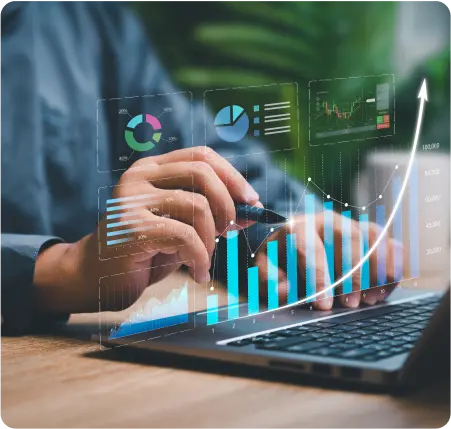 Businessman analyzing graphs and charts on a laptop, focused on data-driven decision-making in a professional setting.